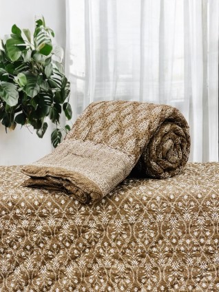Brown and White Printed Quilts